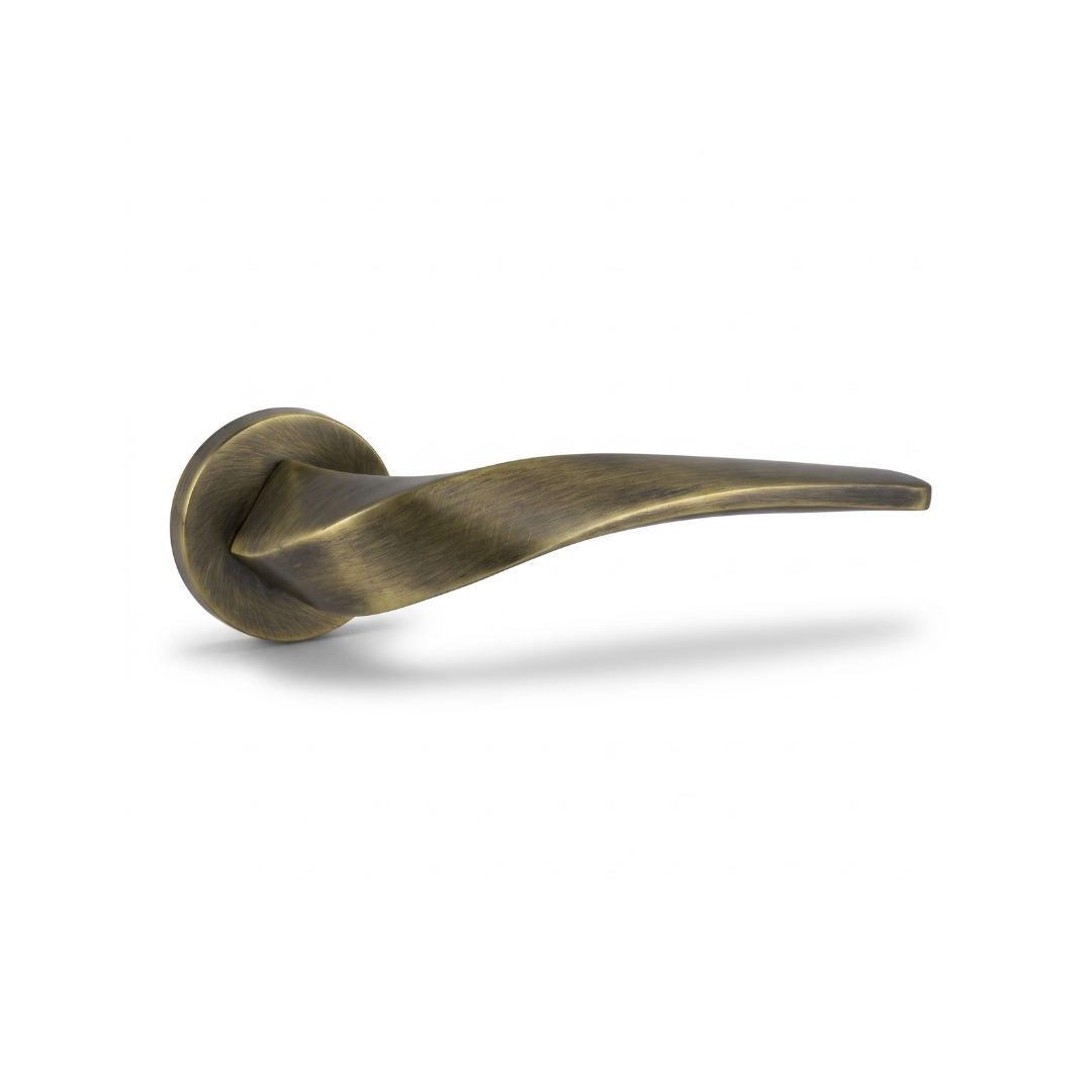 Chelsea antique brass twisted lever door handle on round rose
