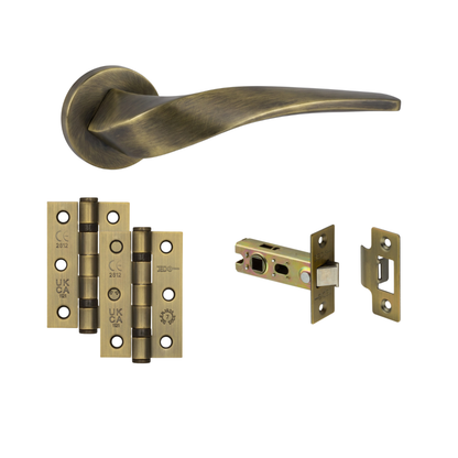 Chelsea antique brass door handle with antique brass hinges and tubular latch
