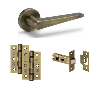 Lisbon antique brass door handle with antique brass hinges and tubular latch
