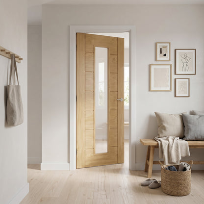 WC19GC oak contemporary internal door with clear glass, fitted in a hallway