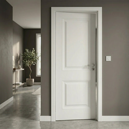 White door in a room with gray walls and a plant.